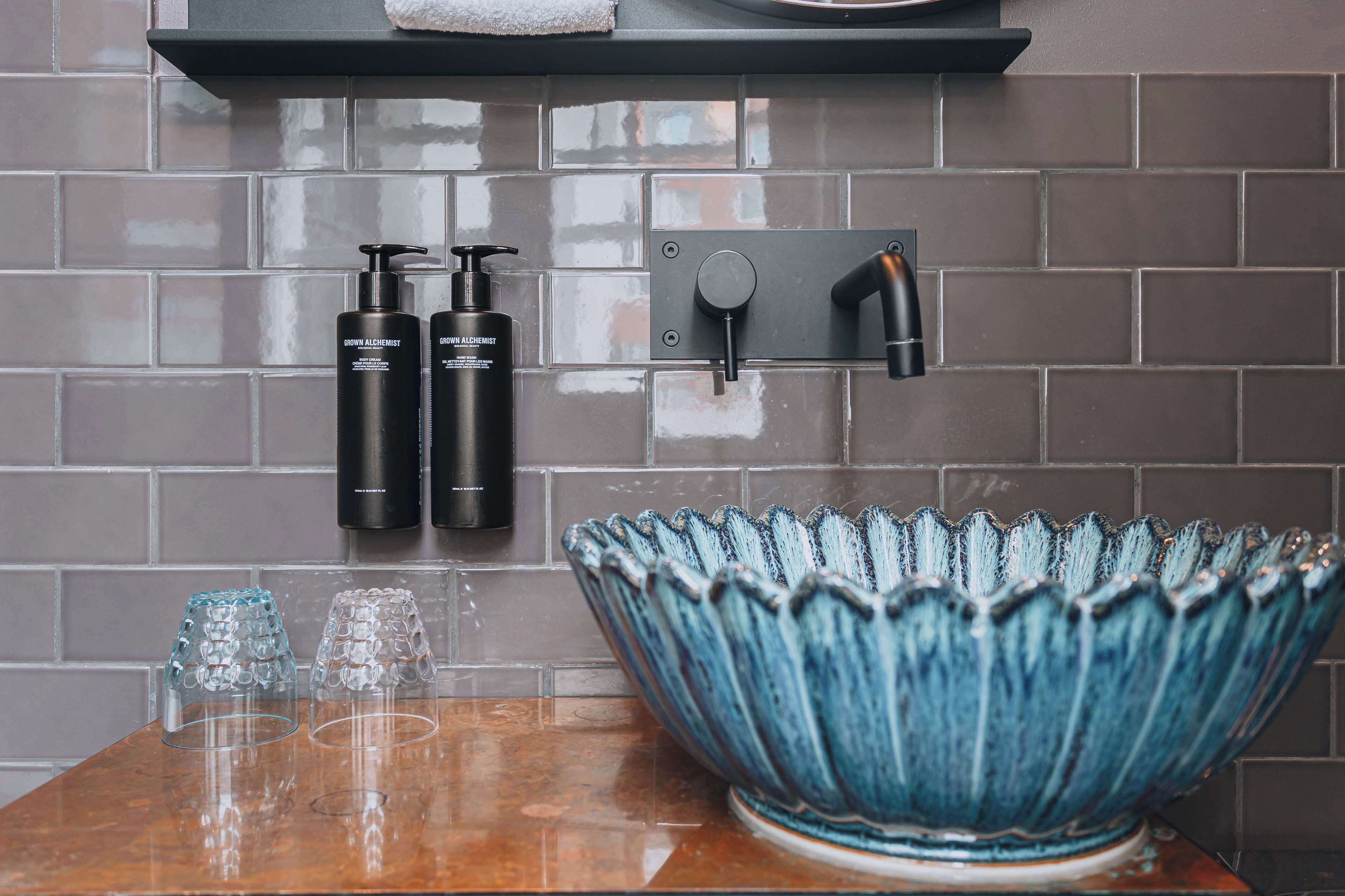 deluxe room, 1 queen bed | bathroom | designer toiletries, hair dryer, towels