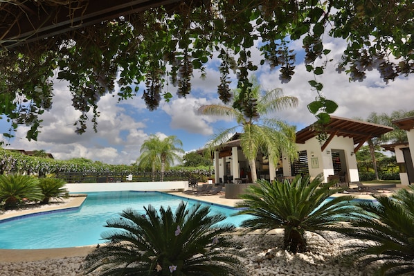 2 outdoor pools, open 9:00 AM to 10:00 PM, pool umbrellas, pool loungers