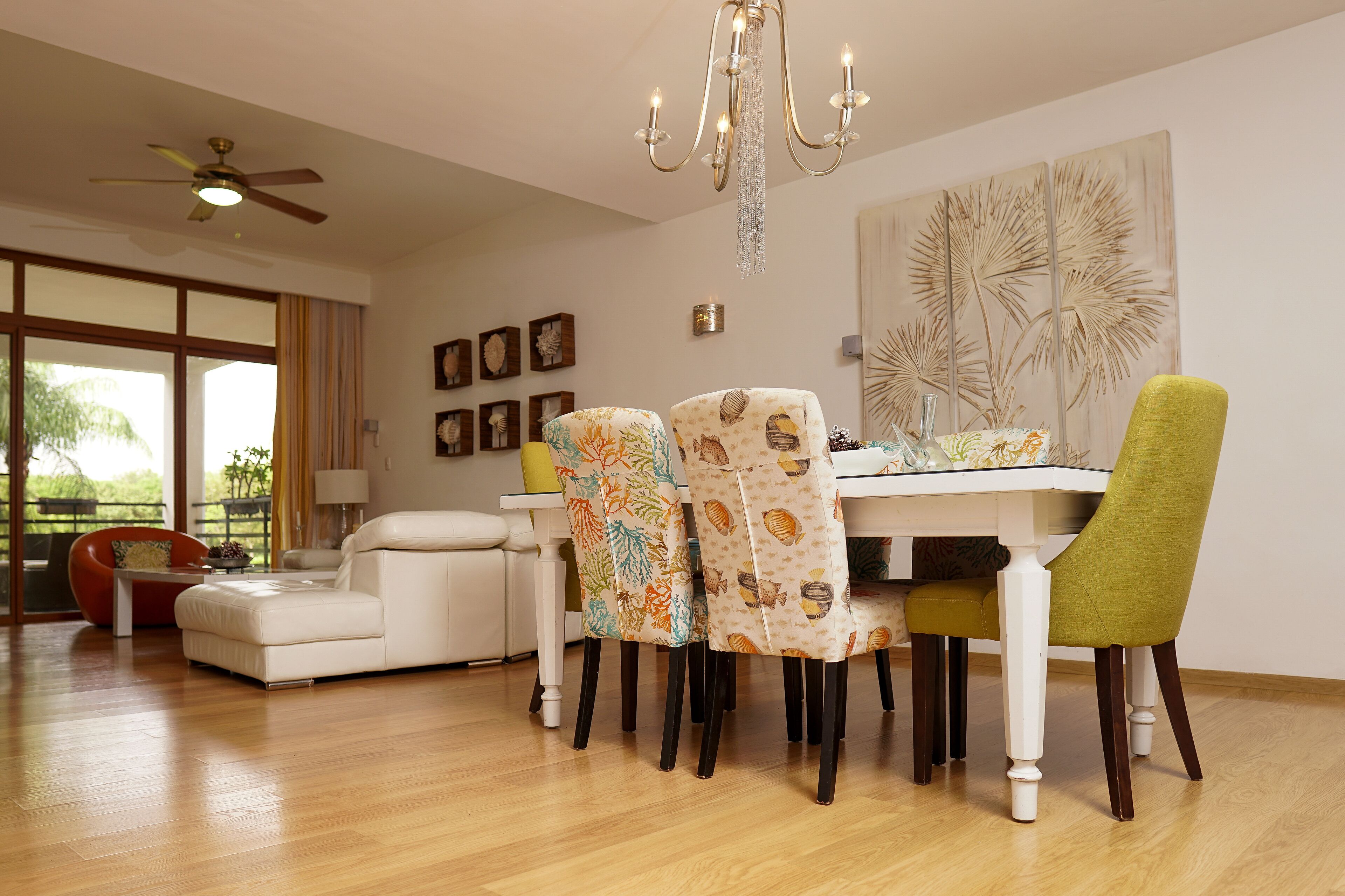 A dining area with a table, chairs, and a chandelier.