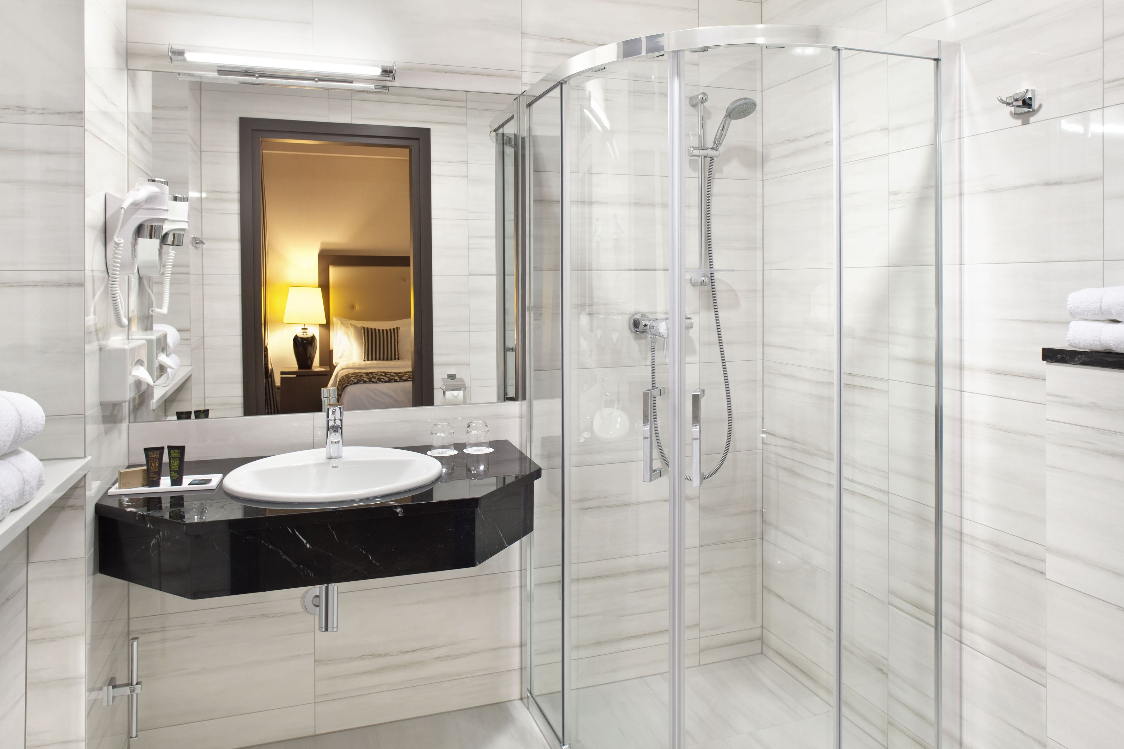 bathtub, free toiletries, hair dryer, towels