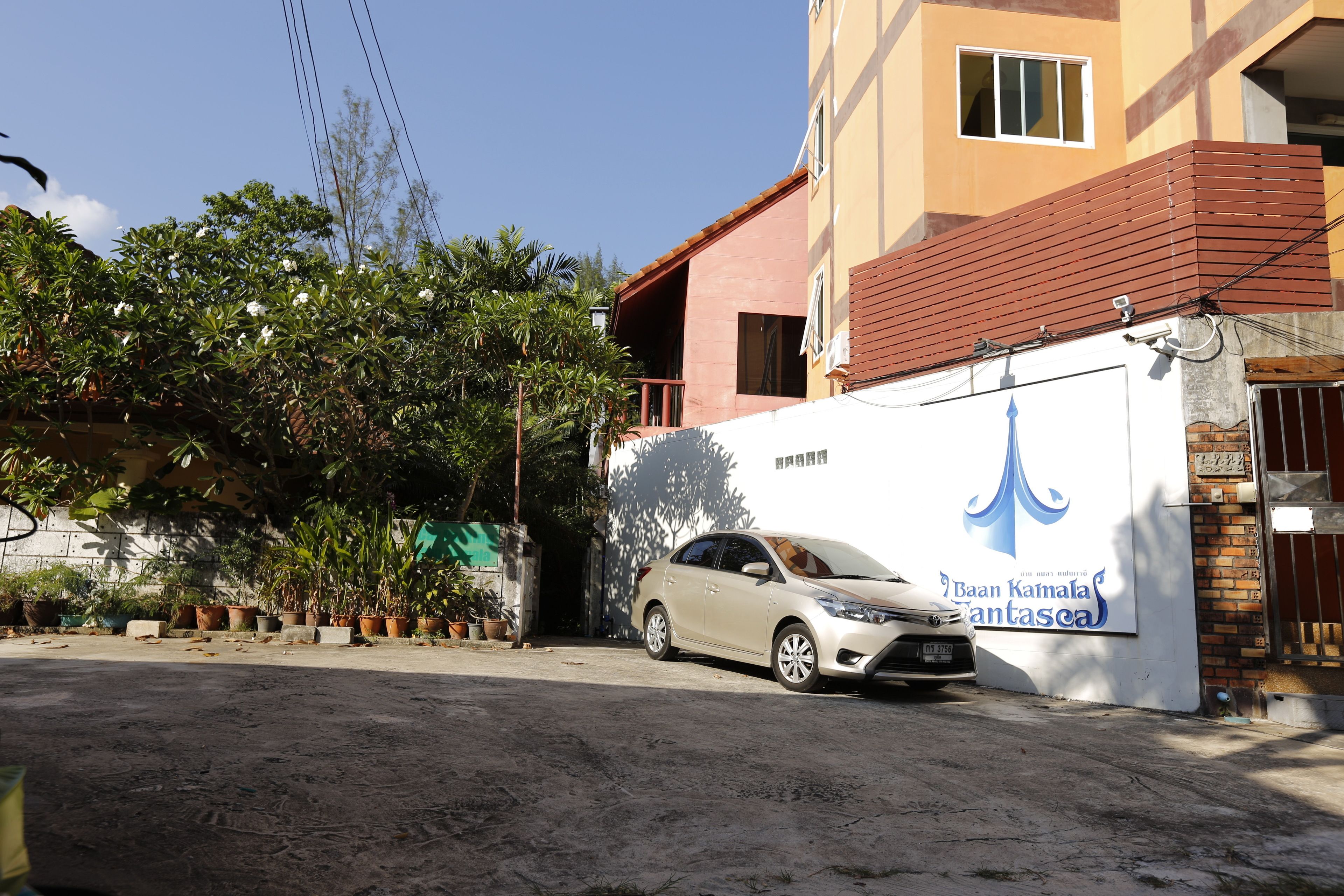 A building with a sign reading "Baan Kamala Fantasca".
