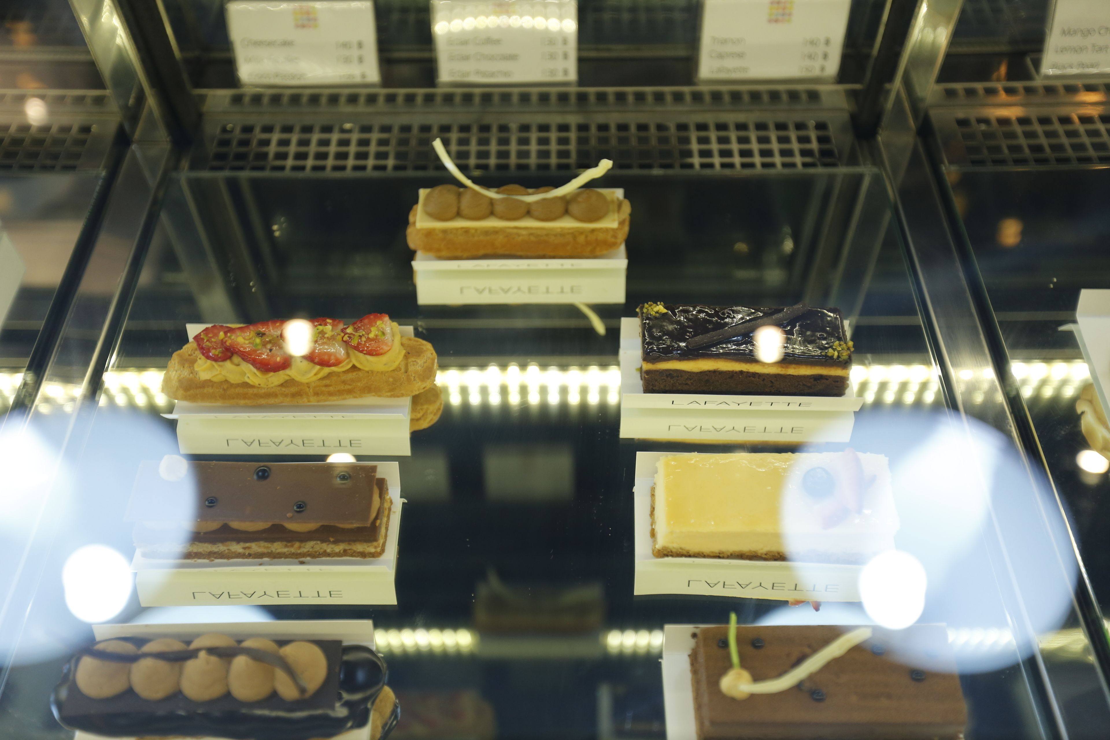 A display case with various desserts labeled 'Gevayelle'.
