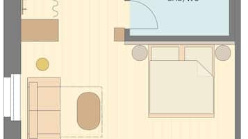 A hotel room layout with a bed, a desk, a chair, a sofa, a small table, and a bathroom.