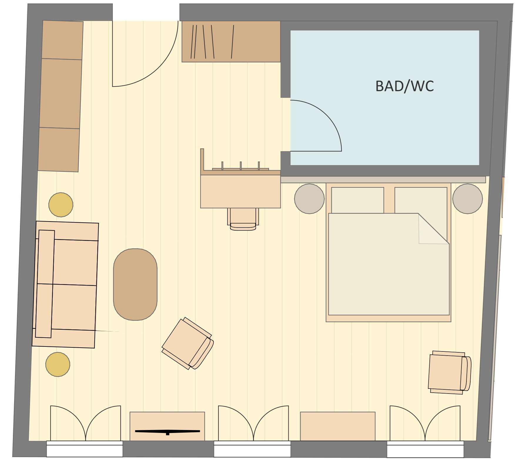 Distribución de una habitación con una cama, dos sillones, una mesita y un sofá. Hay un baño indicado con BAD/WC.