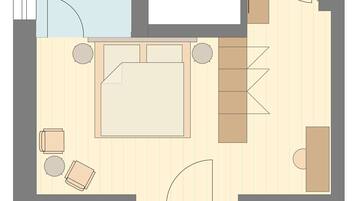 Un plano de planta que muestra una sala de estar, un balcón y un baño.