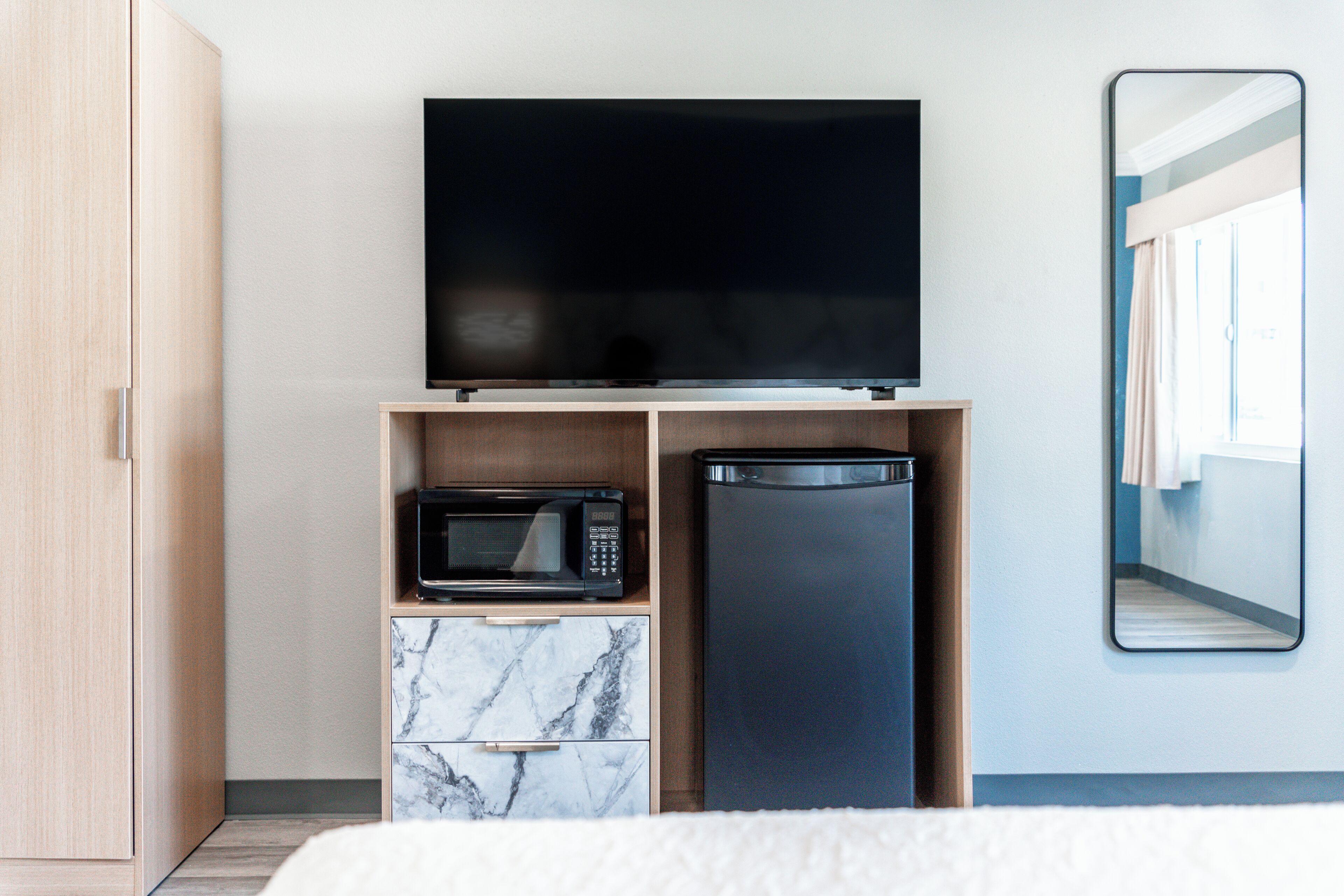 Habitación Deluxe, acceso para personas con movilidad reducida | Cortinas blackout, tabla de planchar con plancha, cunas y wifi gratis 