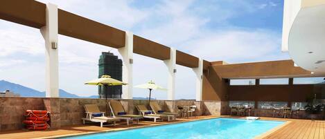 Outdoor pool, pool umbrellas, pool loungers