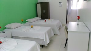 A hotel room with two beds, a desk, and a wardrobe. - Pousada Porto de Galinhas (Ipojuca)