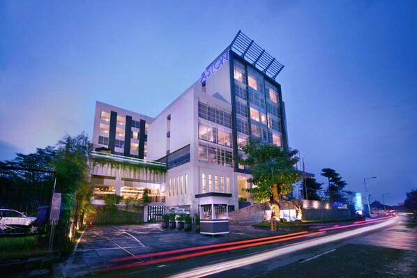 A modern building with a prominent "Aston" sign, featuring a glass facade and a rooftop structure. - Aston Jember Hotel and Conference Center (Jember)
