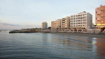 Beach nearby, beach umbrellas, beach towels