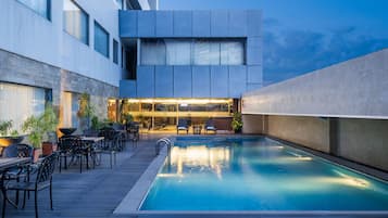 Outdoor pool, open 7:00 AM to 9:00 PM, sun loungers