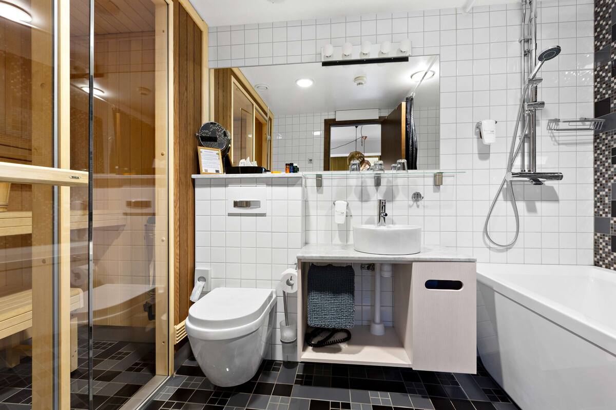 suite, 1 king bed, non smoking, balcony (with sofabed) | bathroom | shower, hair dryer, heated floors, towels