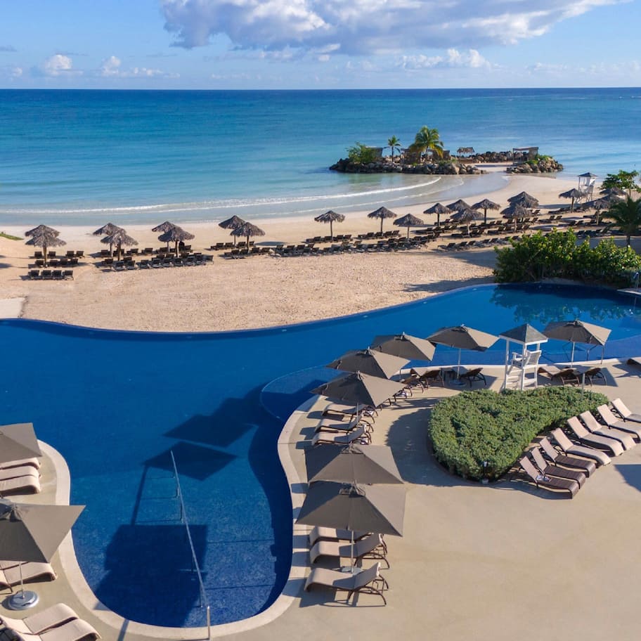On the beach, white sand, free beach cabanas, sun loungers