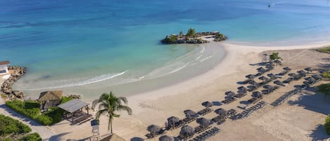 On the beach, white sand, free beach cabanas, sun-loungers