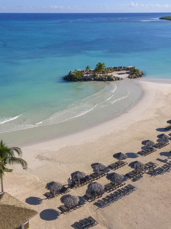 On the beach, white sand, free beach cabanas, sun loungers