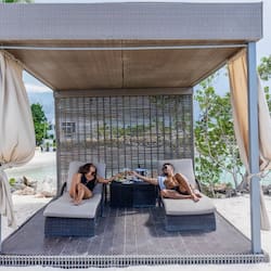 On the beach, white sand, free beach cabanas, sun loungers