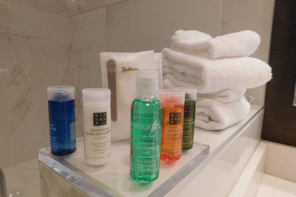 shower, free toiletries, hair dryer, towels