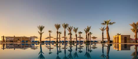 Indoor pool, outdoor pool, pool umbrellas, sun loungers