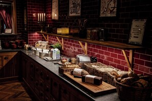 A kitchen counter with various food items and kitchenware.