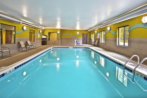 An indoor swimming pool with clear water, surrounded by yellow walls and a tiled floor. - Holiday Inn Express Hastings by IHG (Hastings)