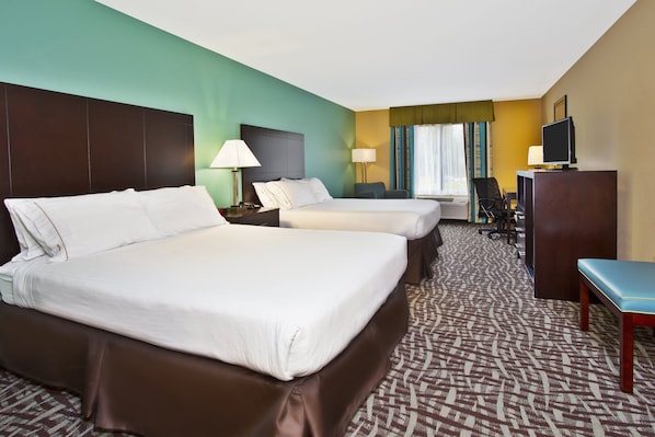 A hotel room with two beds, a desk, a chair, and a television. - Holiday Inn Express Hastings by IHG (Hastings)