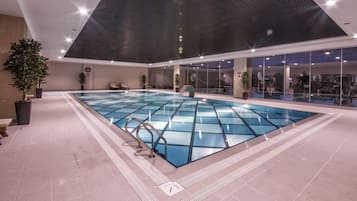 Indoor pool, open 8:00 AM to 10:00 PM, pool loungers