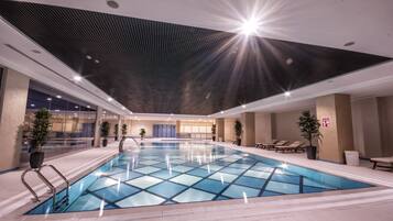 Indoor pool, open 8:00 AM to 10:00 PM, pool loungers
