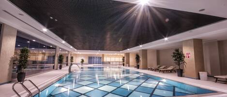 Indoor pool, open 8:00 AM to 10:00 PM, pool loungers
