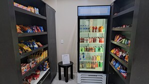 A snack shop with shelves stocked with various snacks and beverages. - Holiday Inn Express Kenedy by IHG (Kenedy)