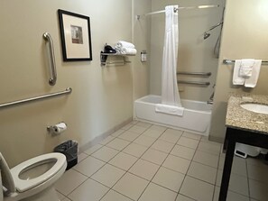 Enjoy a refreshing shower or soak in the bathtub in this well-appointed bathroom.