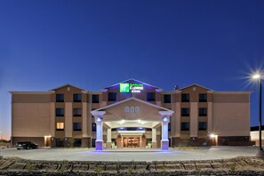 A Holiday Inn Express & Suites building with a central entrance, multiple floors, and a parking lot. - Holiday Inn Express Hotel & Suites Deming Mimbres Valley by IHG (Deming)