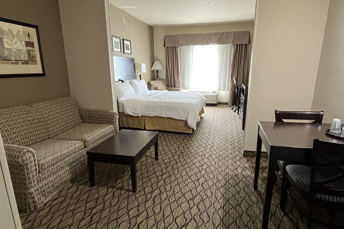 Suite, 1 King Bed | Desk, blackout drapes, iron/ironing board, free cribs/infant beds