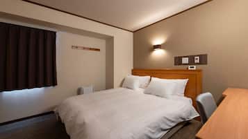 Down comforters, desk, blackout drapes, iron/ironing board