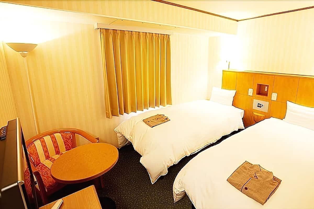 Down comforters, desk, blackout drapes, iron/ironing board