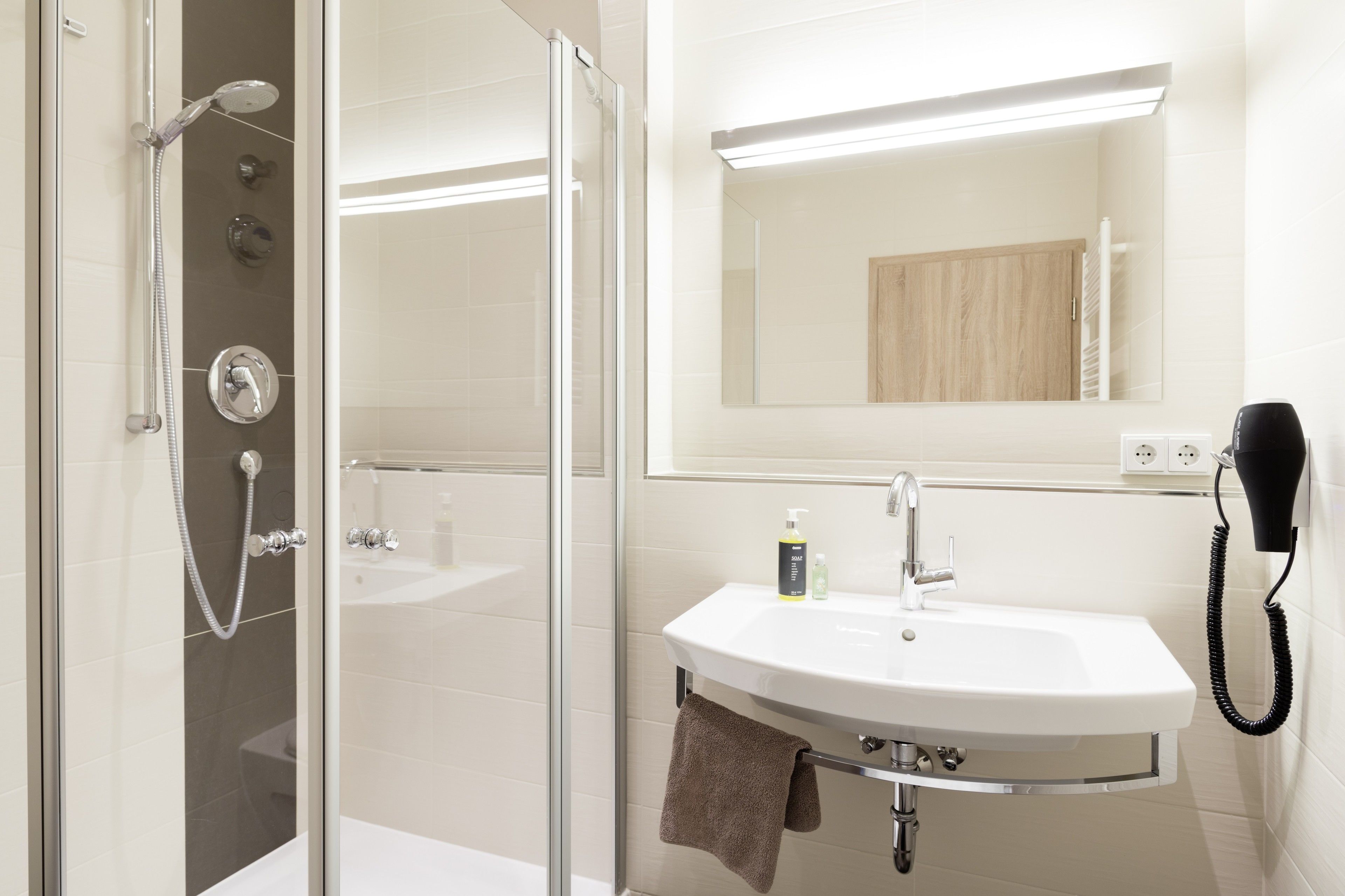 shower, free toiletries, hair dryer, towels