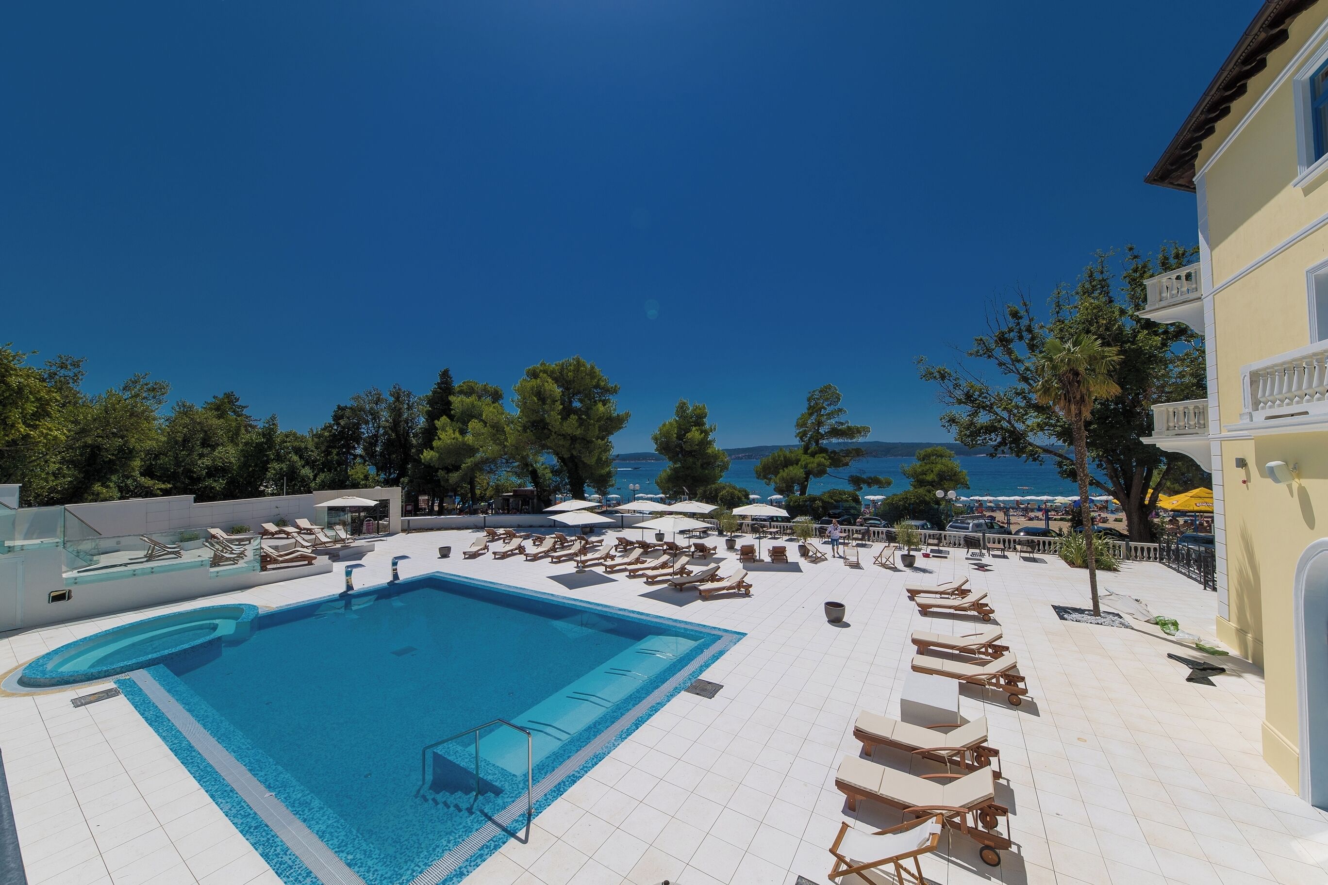 seasonal outdoor pool, pool umbrellas, pool loungers