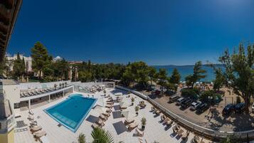 Seasonal outdoor pool, pool umbrellas, pool loungers