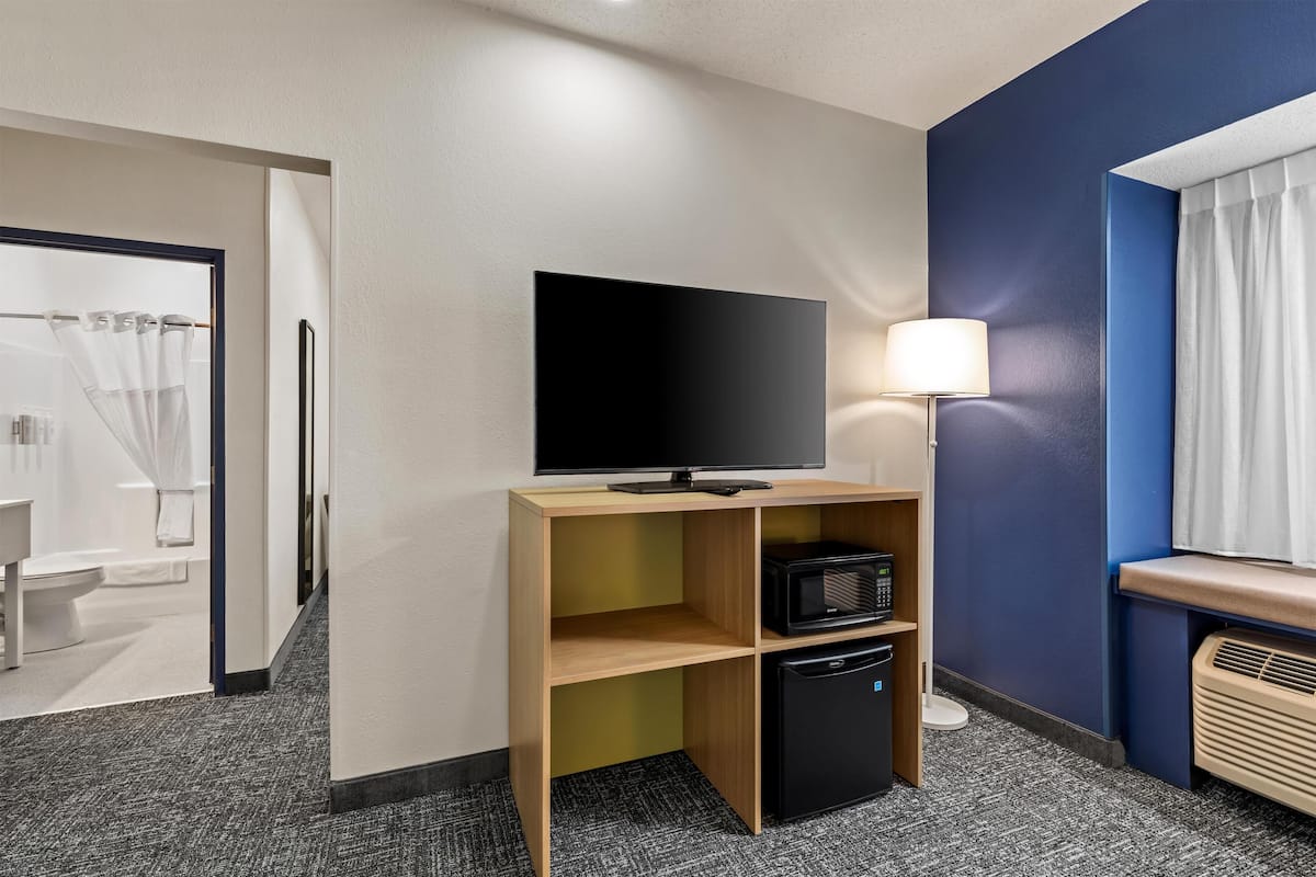 Desk, laptop workspace, blackout curtains, iron/ironing board