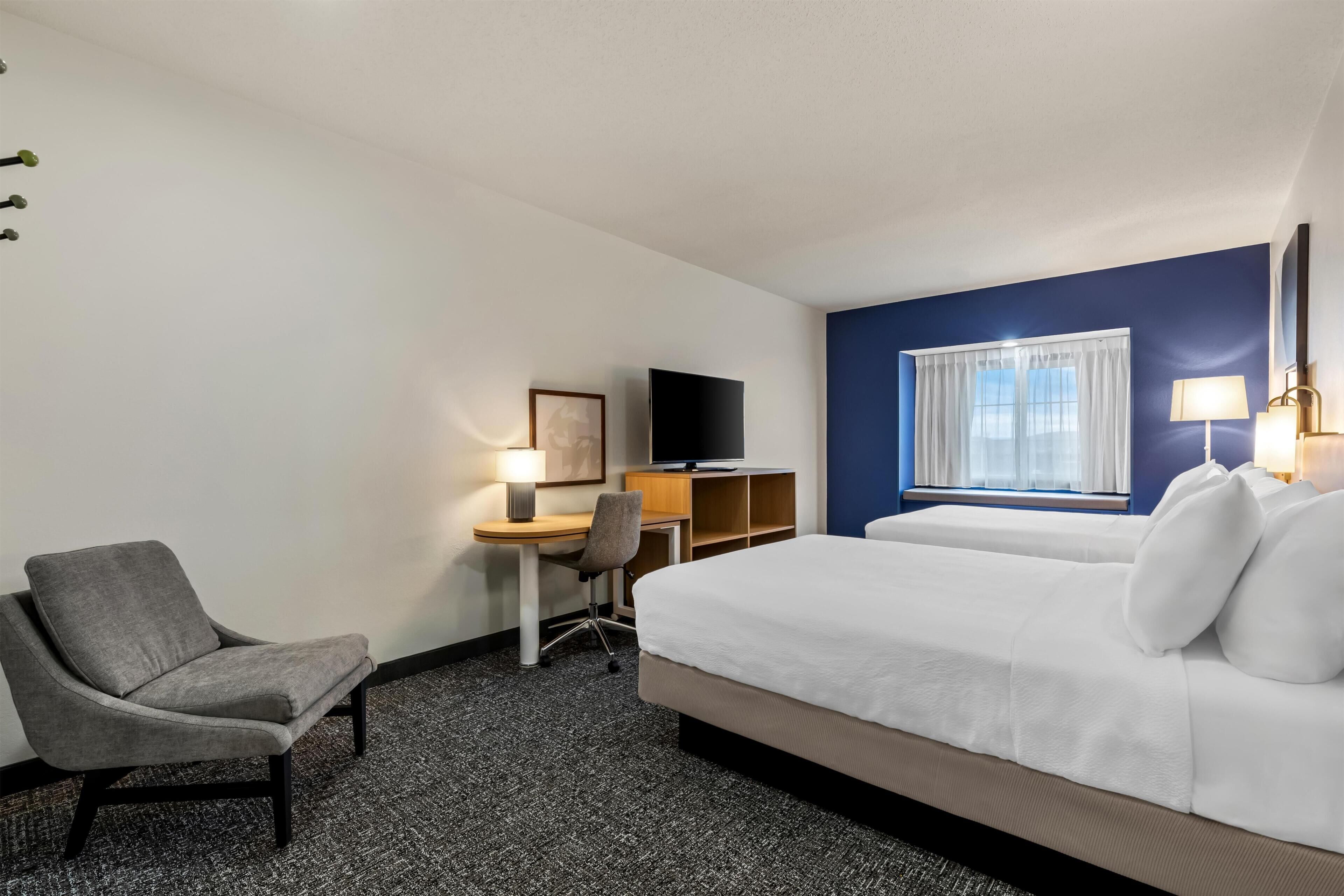 Suite, Multiple Beds | Desk, laptop workspace, blackout drapes, iron/ironing board
