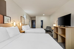 Suite, Multiple Beds | Desk, laptop workspace, blackout drapes, iron/ironing board