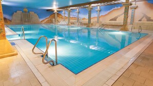 An indoor swimming pool with clear water, a tiled floor, and a desert-themed mural on the walls. - TLH Derwent Hotel - TLH Leisure, Entertainment and Spa Resort (Torquay)