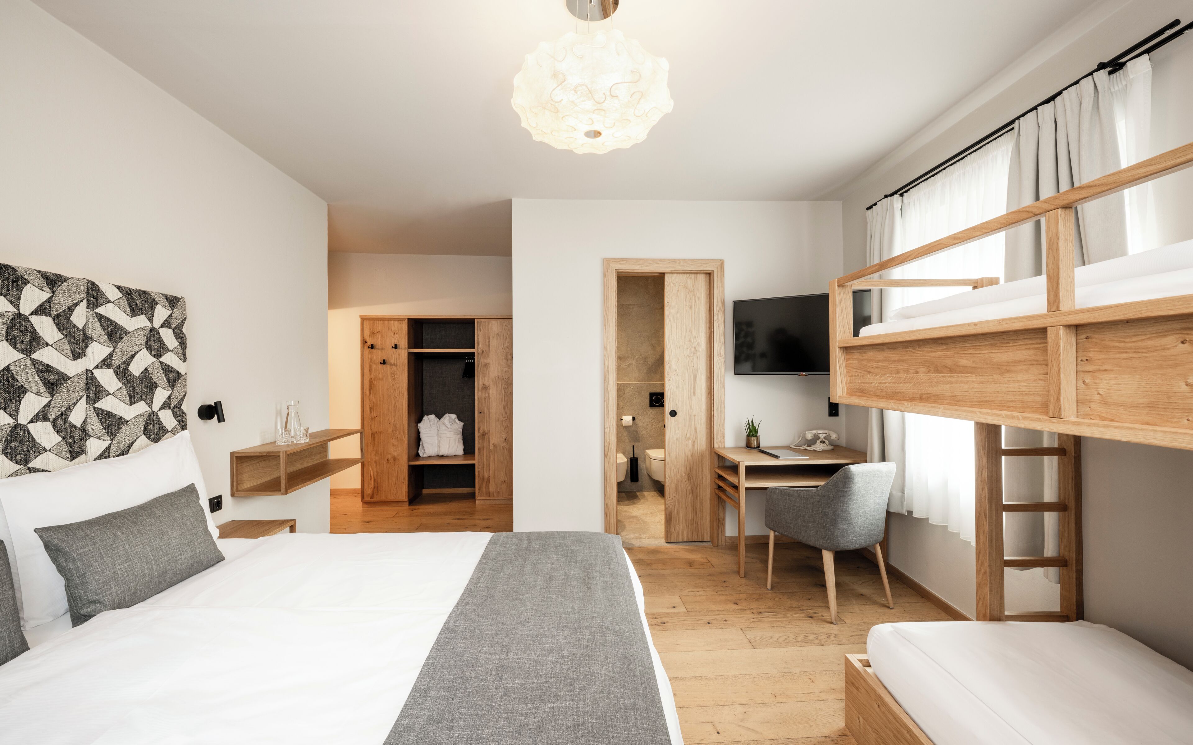 Superior Quadruple Room | Minibar, in-room safe, desk, blackout drapes