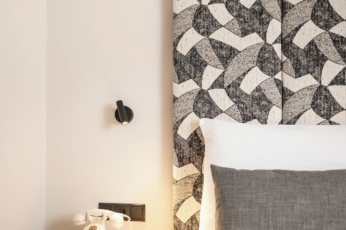 Small Double Room | Minibar, in-room safe, desk, blackout drapes