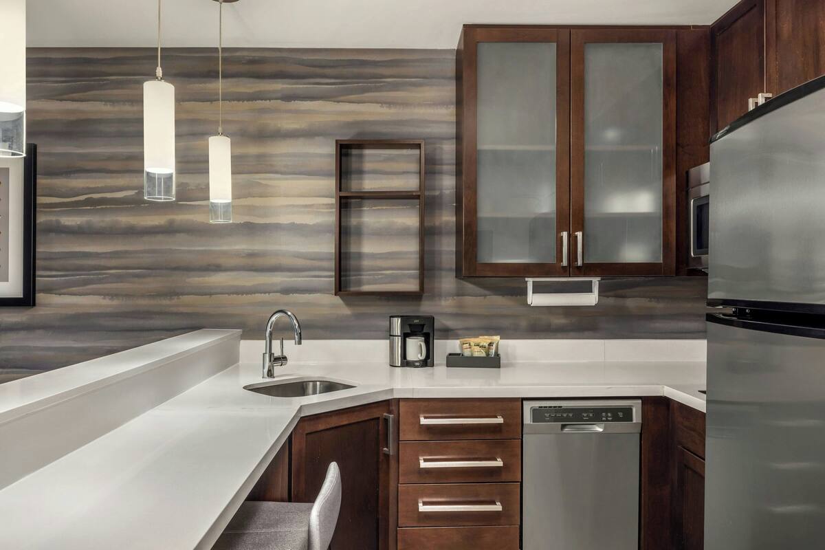 one-bedroom suite, 1 king bed with sofa bed | private kitchen | fridge, microwave, stovetop, dishwasher