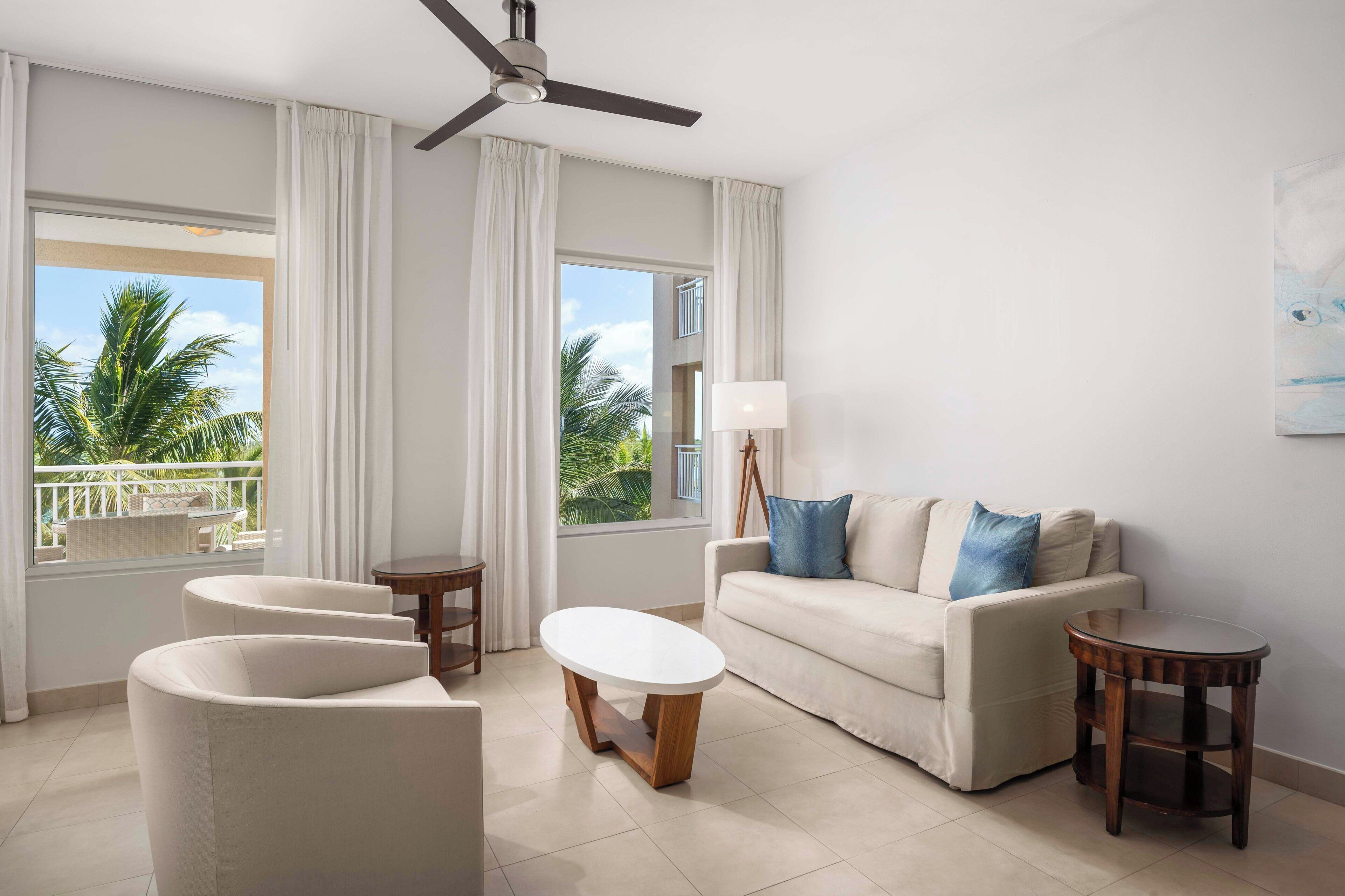 One Bedroom Oceanfront Suite | Living room | Flat-screen TV