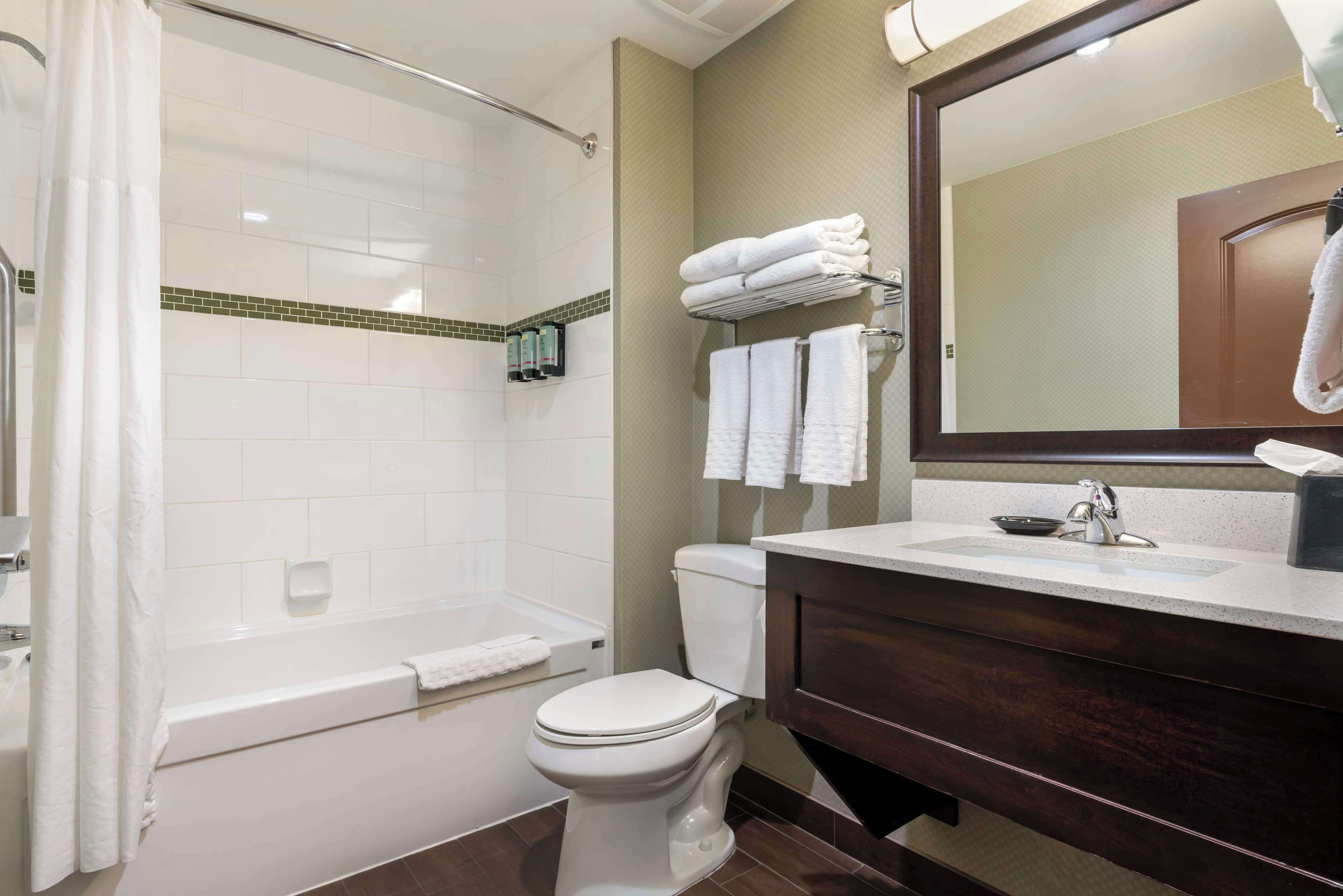 standard room, 2 queen beds, non smoking, refrigerator & microwave | bathroom | combined shower/bathtub, free toiletries, hair dryer, towels