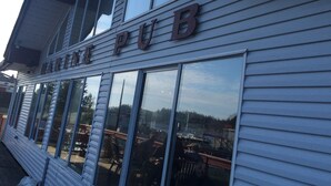A building with the sign "MARINE PUB" above the entrance.