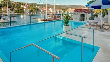 Outdoor pool, pool umbrellas, pool loungers