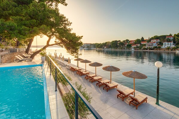 Outdoor pool, pool umbrellas, sun loungers
