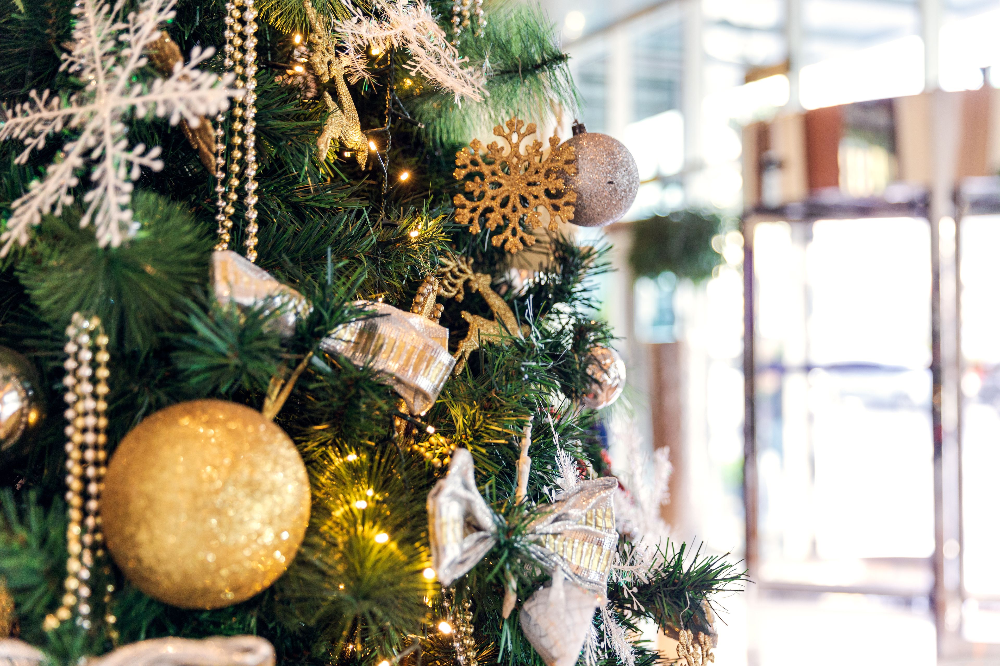 A Christmas tree with various ornaments and decorations.